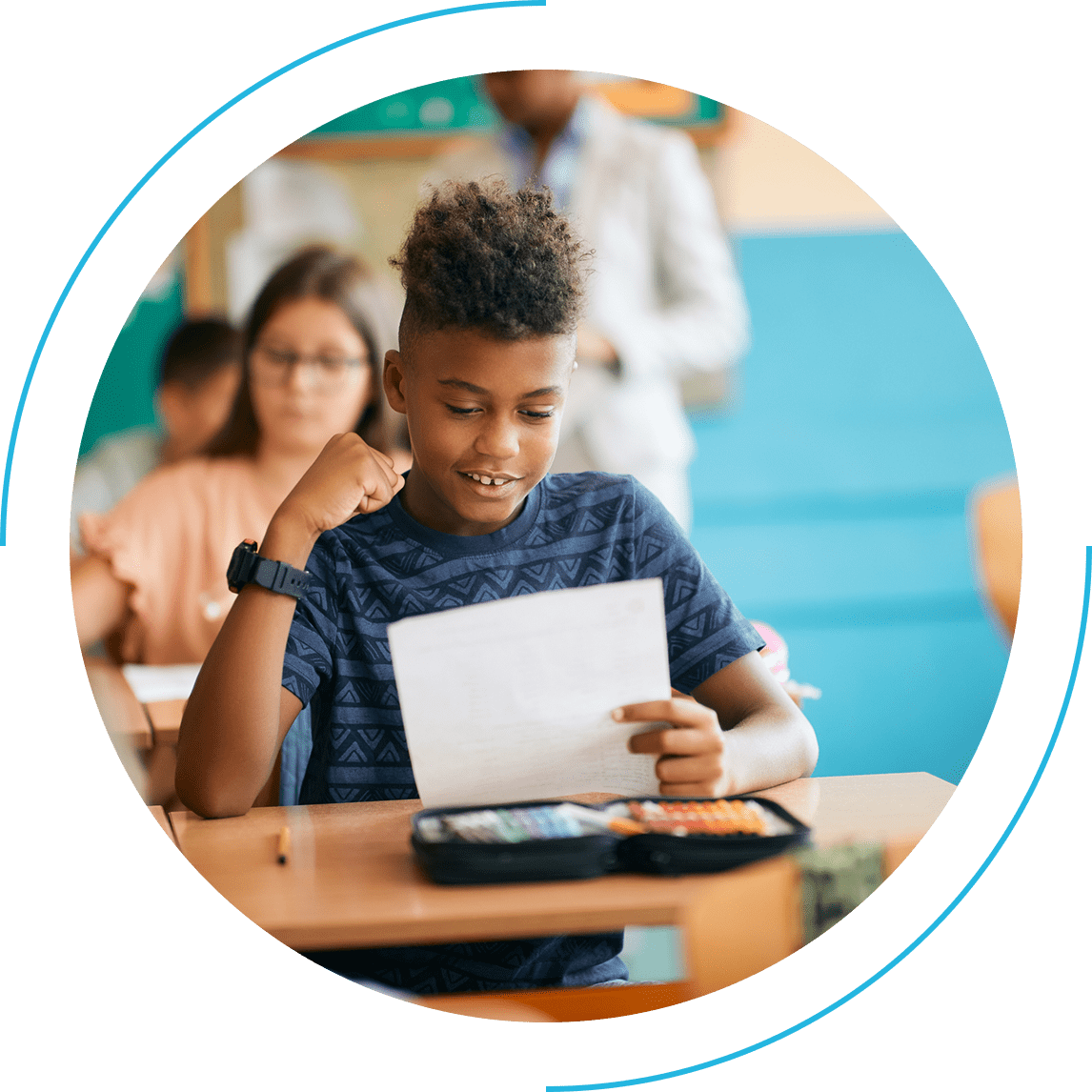 Student reading paper at desk